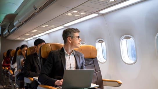 A man sitting inside an airplane.