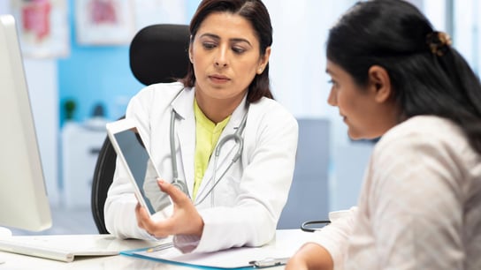 Women looking AI magazine 