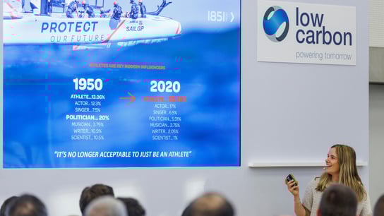 Hannah Mills, strategist of Great Britain SailGP Team, speaks at a Low Carbon conference alongside Roy Bedlow, CEO of Low Carbon.