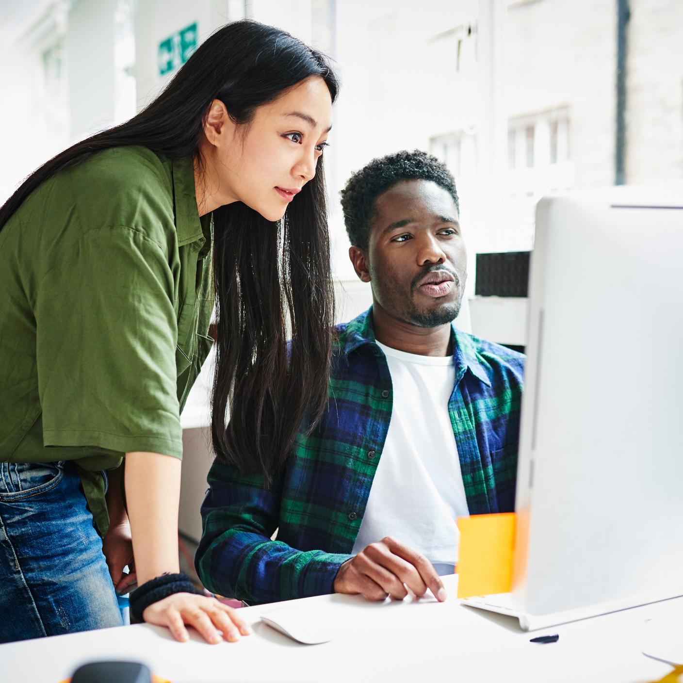 Two people discussing in an office.