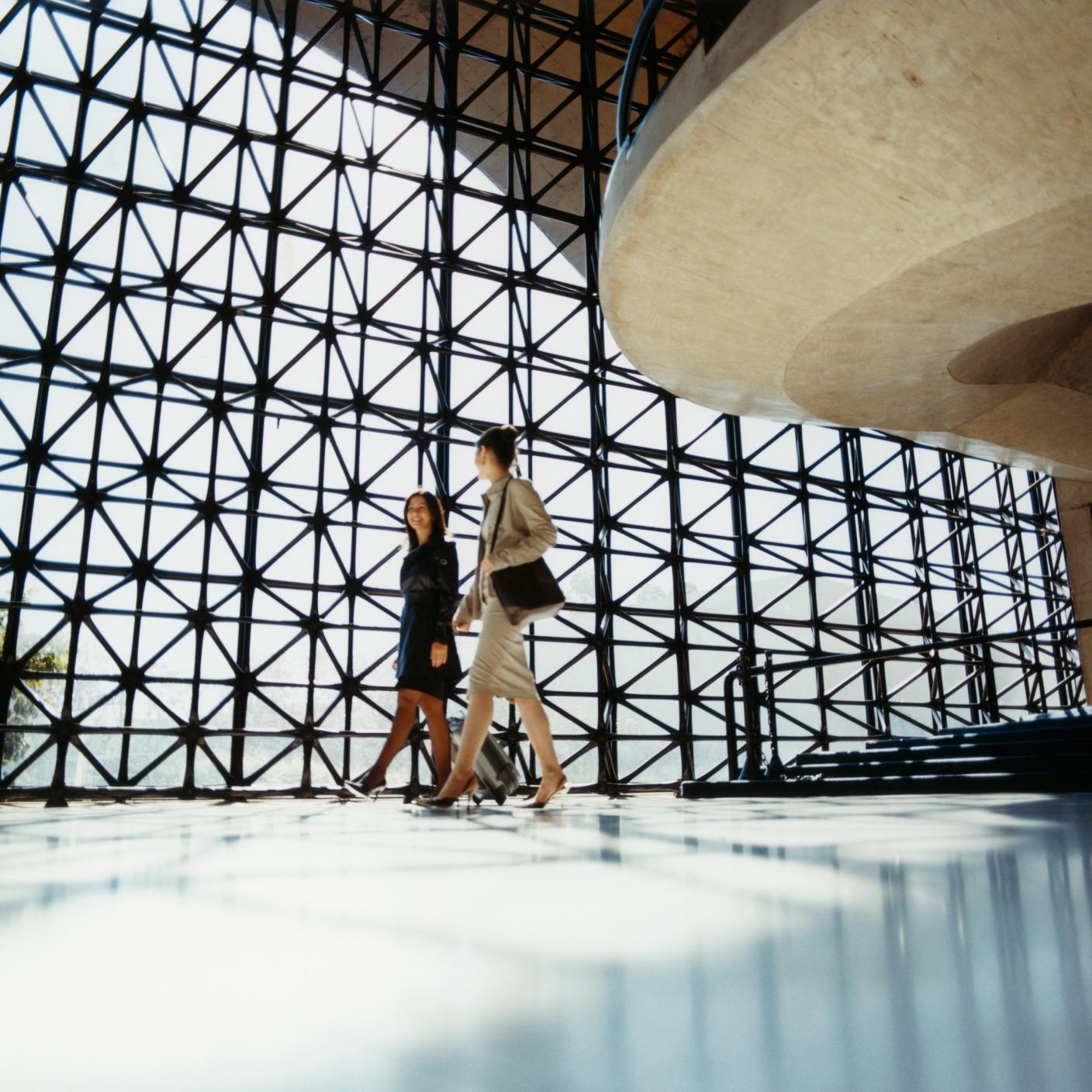 Businesswomen Walking in Lobby