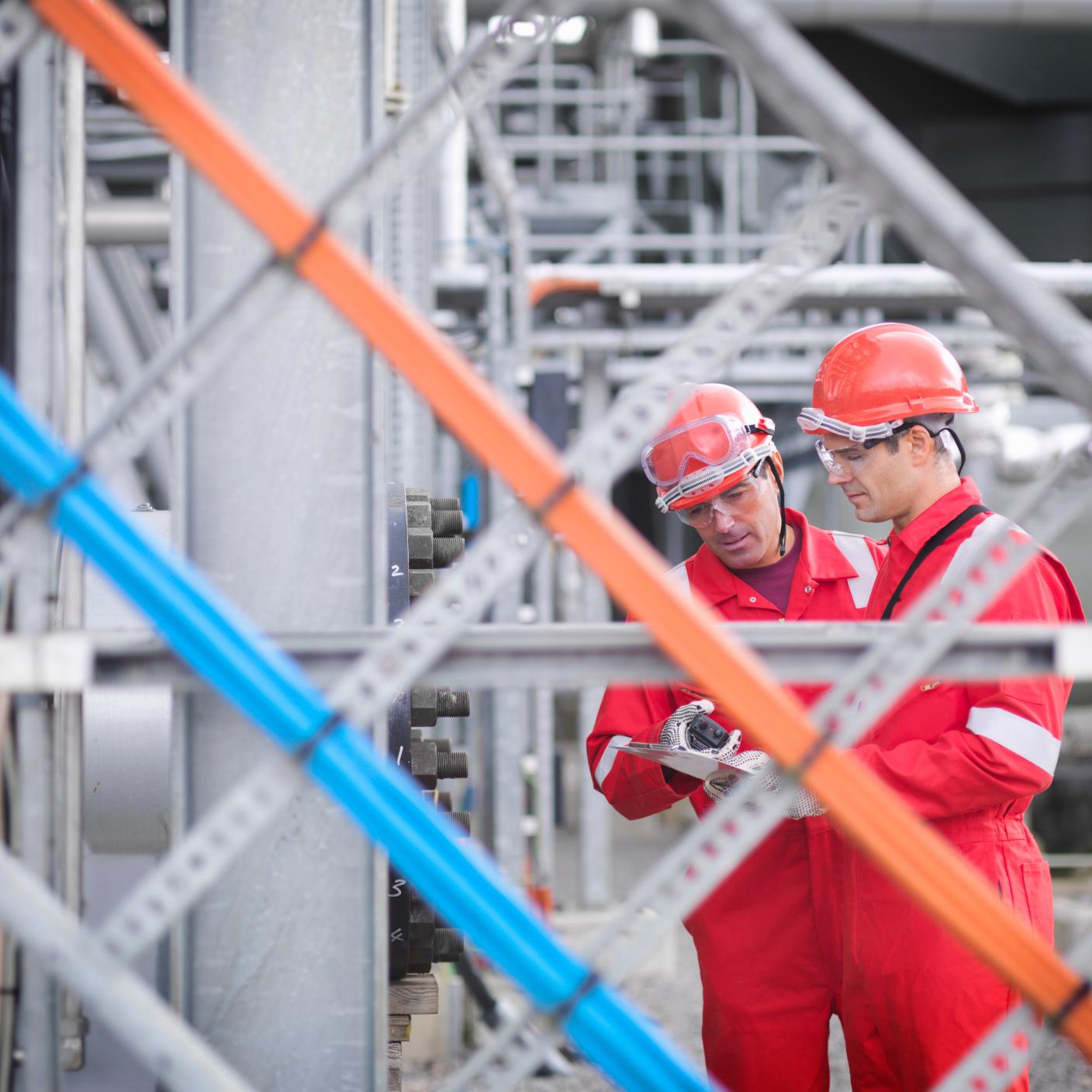 Workers inspect gas storage plant, in Hampshire, England