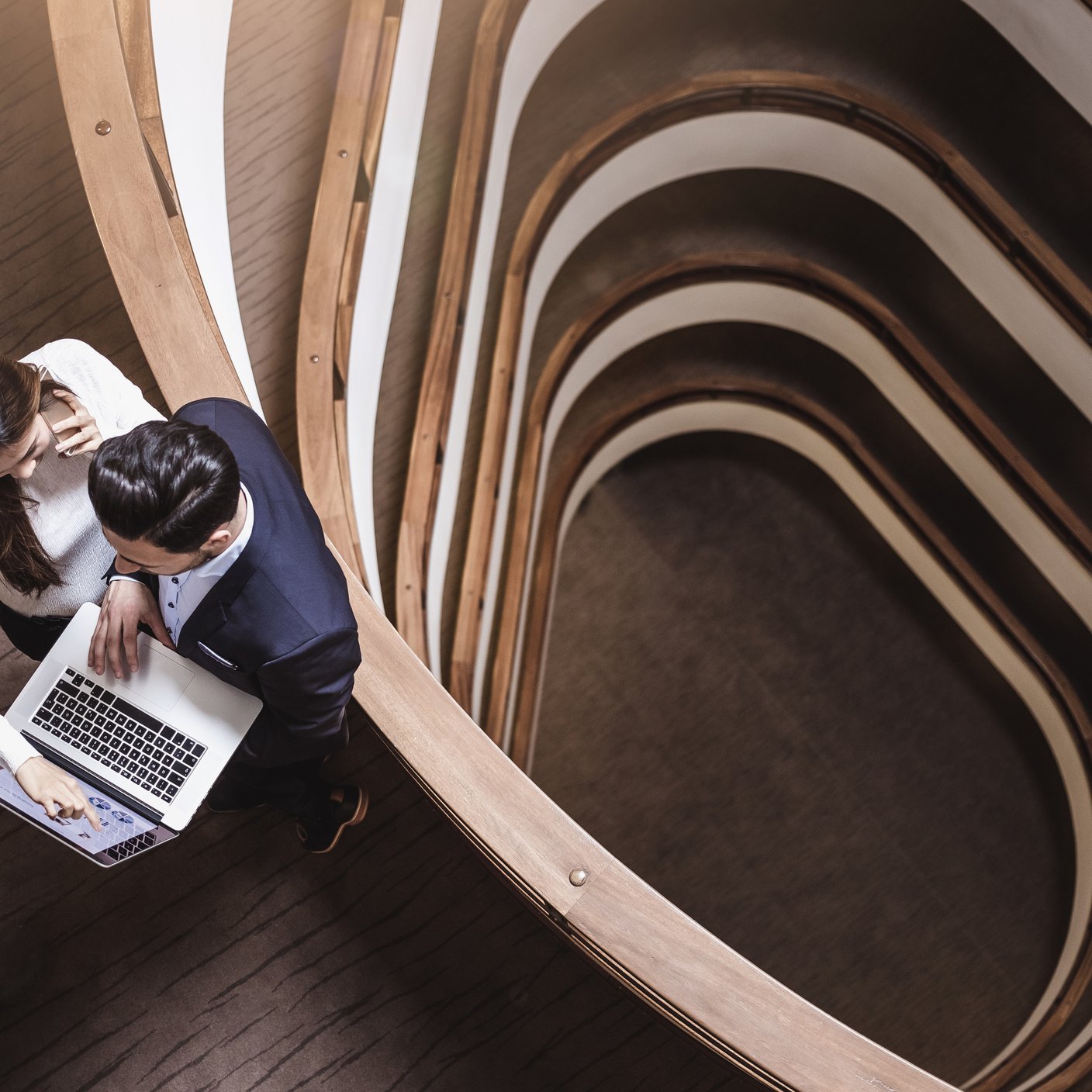 2 people looking at laptop 