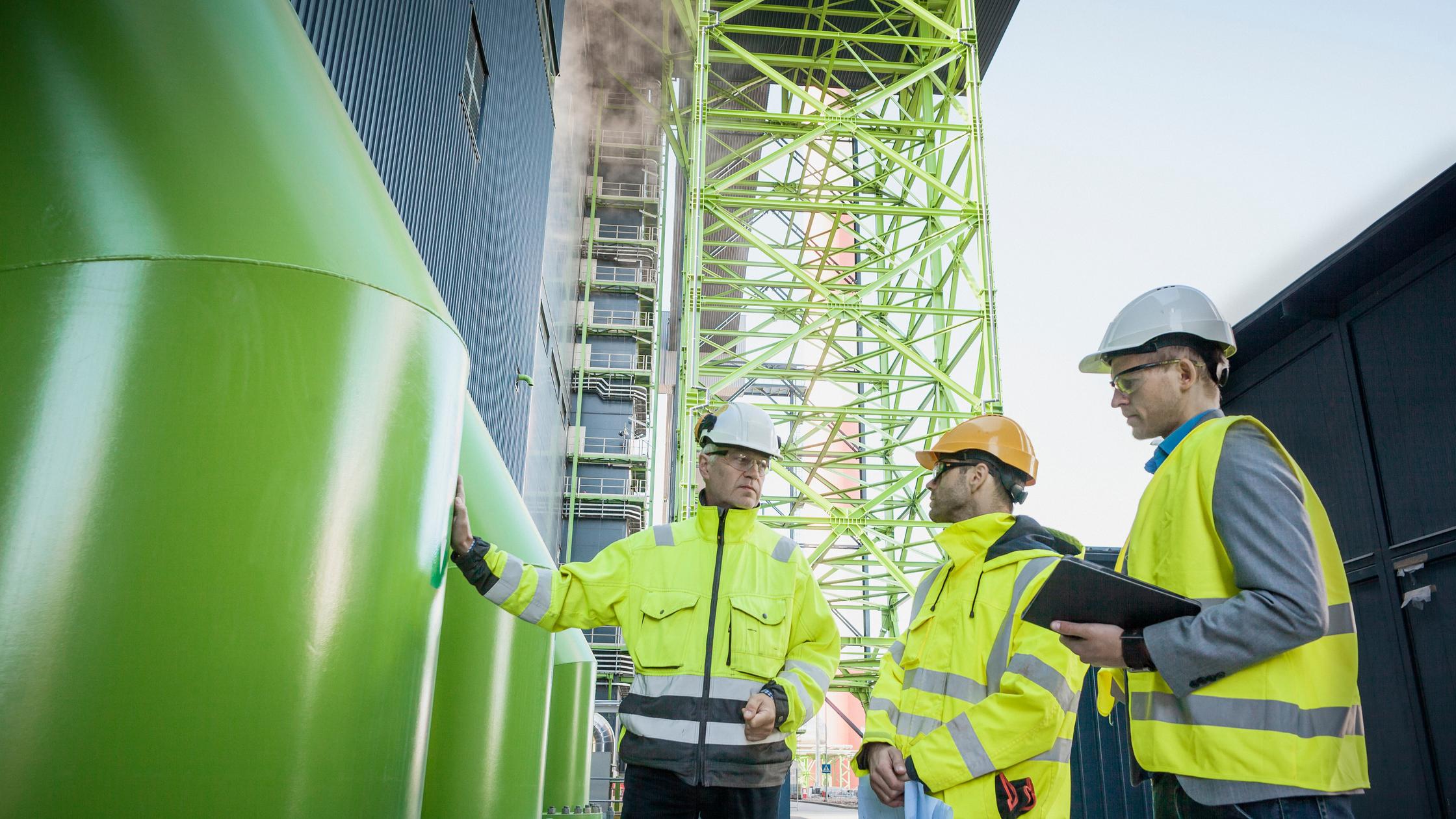 Engineers on modern power station construction site.