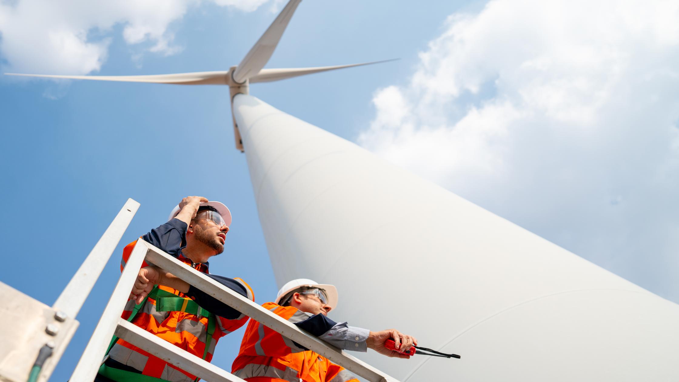 engineers at the base of windmill