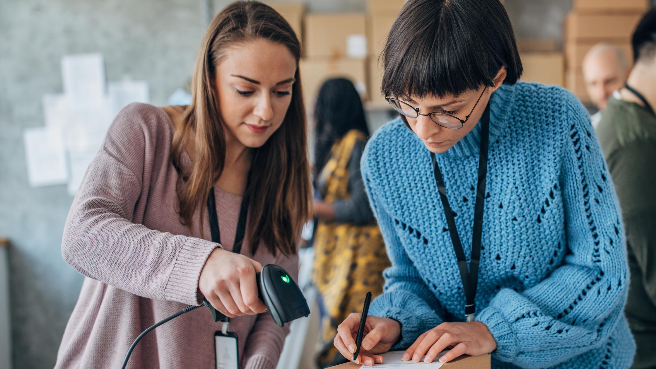 People working in a warehouse.